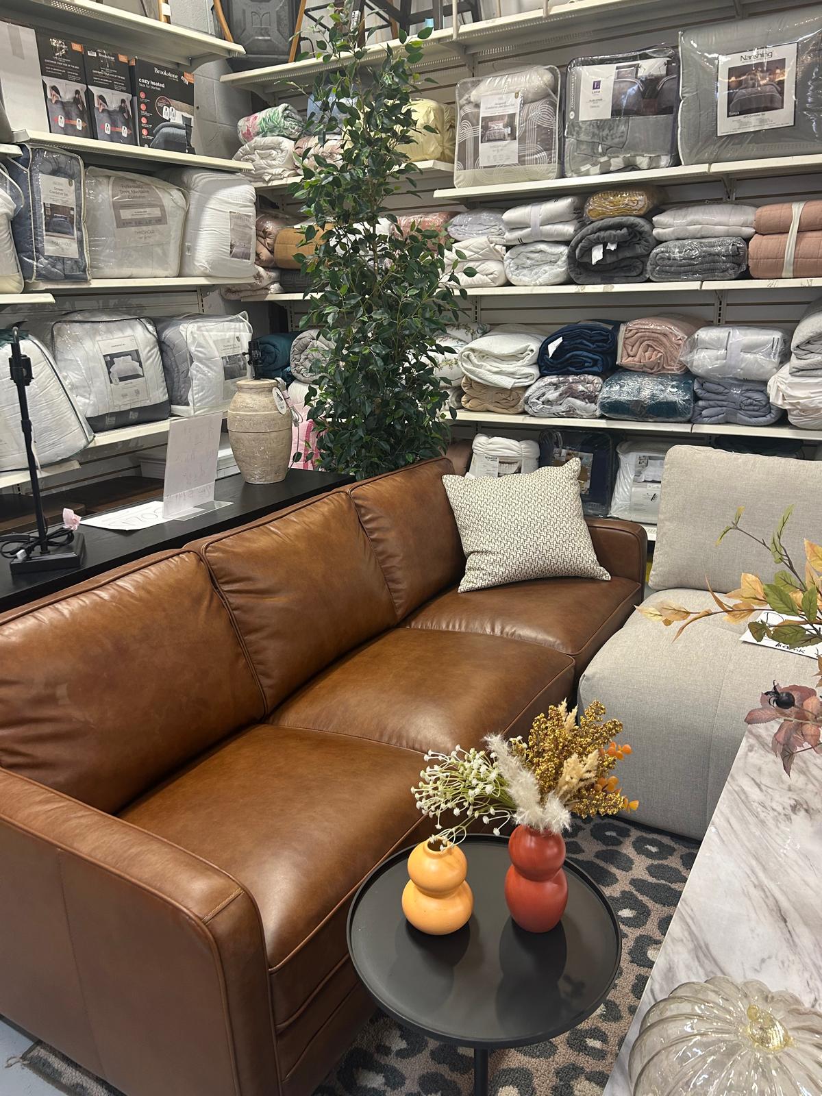 Brown leather sofa inside the Fast Design showroom